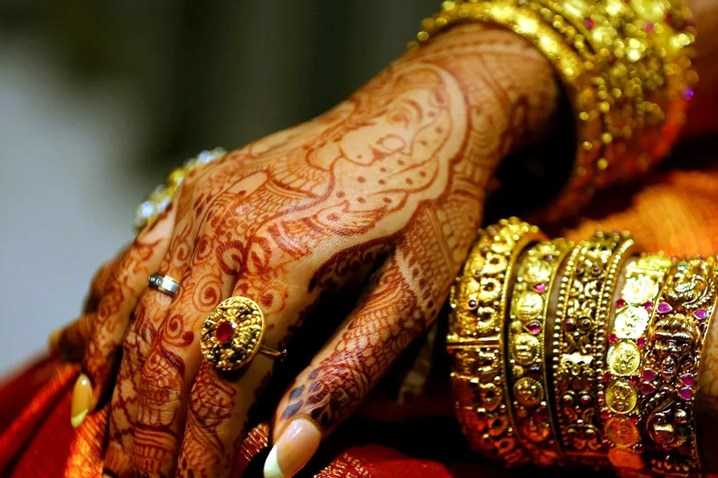 Close-up henna with gold jewellery