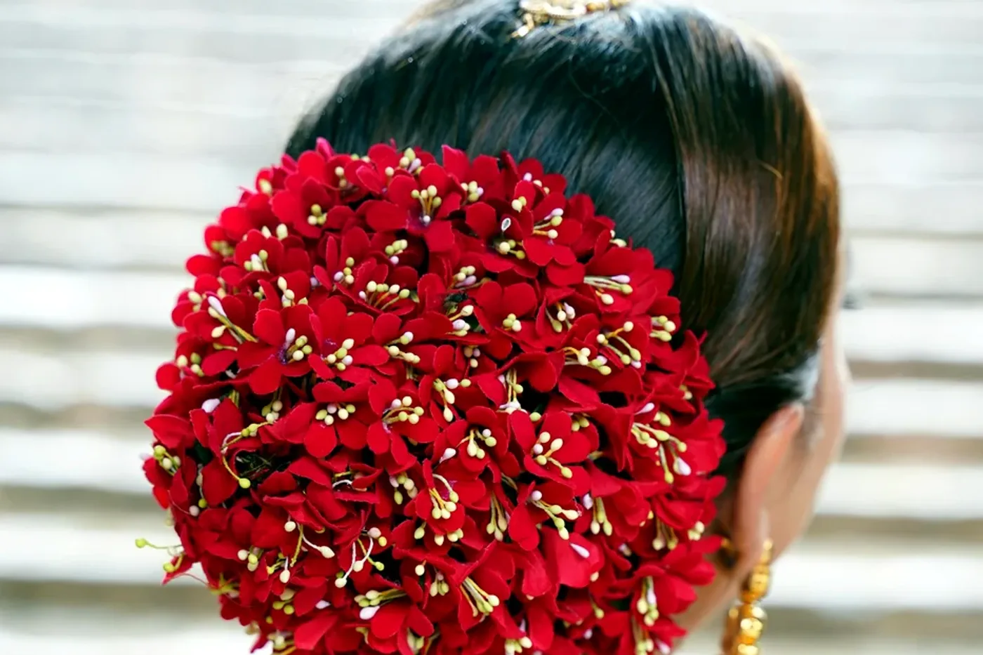Classic festive floral bun with red gajra
